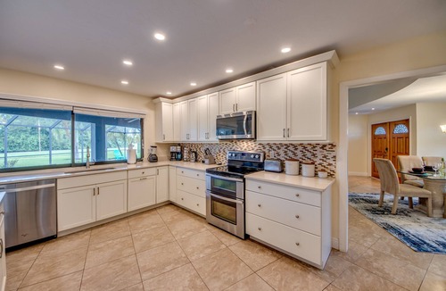 Lochmoor Waterway Estates Villa | Villa Journey - newly renovated, large pool, adjoining small park with lake