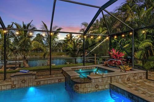 Direct Access Waterfront Villa with Heated Pool & Spa - Edgewater Escape - Roelens Vacations in Cape Coral